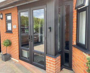 House with uPVC doors and windows installed attractive plants on drive