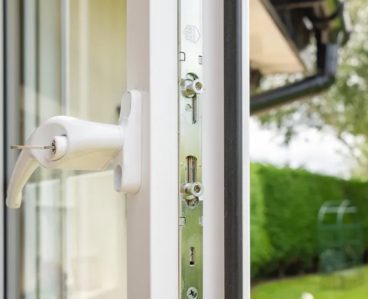 white uPVC window open with key